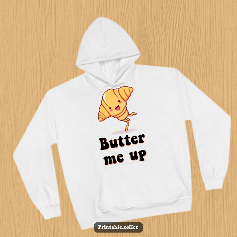 Funny croissant hoodie featuring a joyful cartoon croissant with legs, doing a cartwheel.