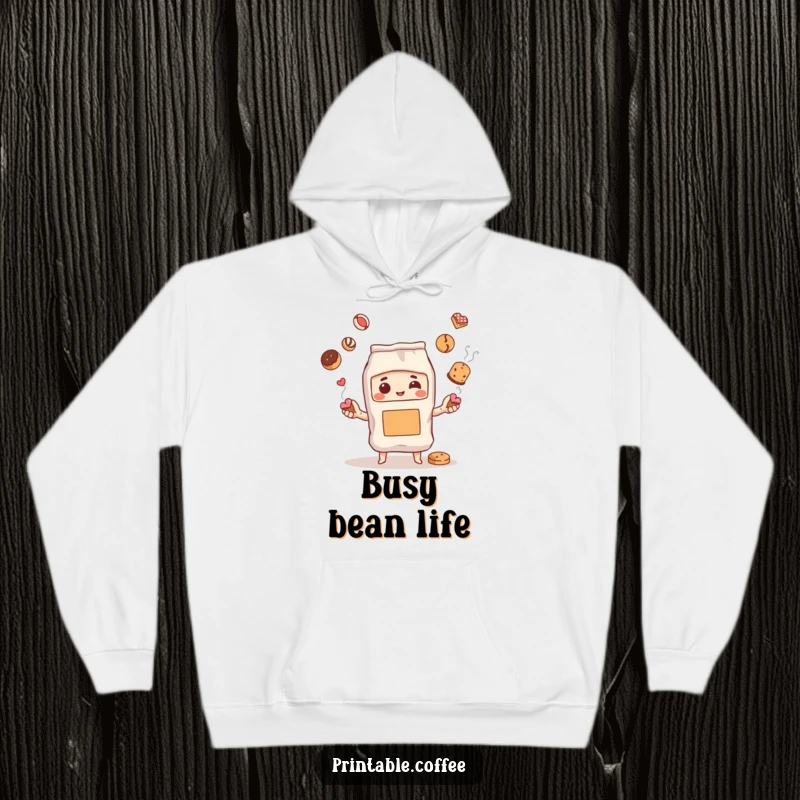 Funny hoodie depicting a steaming coffee bag character expertly juggling pastries, offering warmth and a touch of playful indulgence.