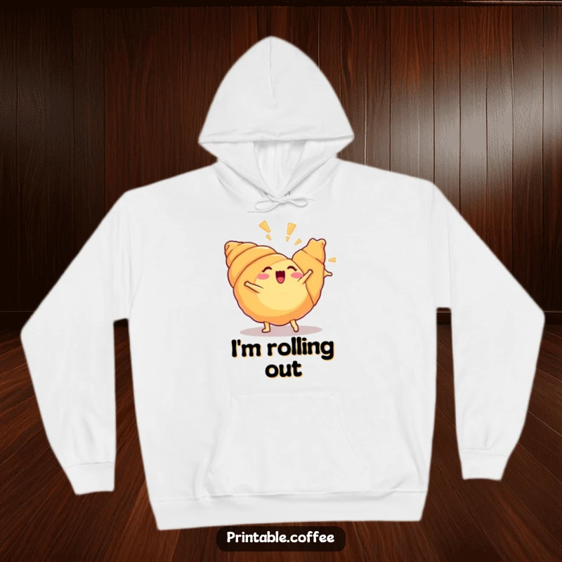 Funny croissant hoodie showcasing an energetic croissant doing a cartwheel, flakiness flying, symbolizing playful energy and warmth.
