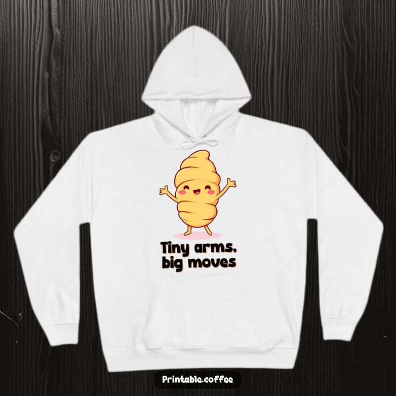 Funny croissant hoodie showcasing a jolly pastry character in a happy dance pose, arms waving wildly, embodying ultimate comfort and comedic charm.